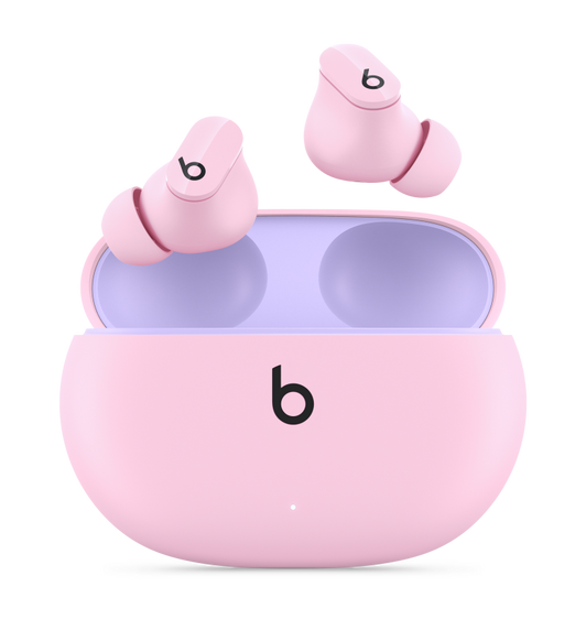 Beats Studio Buds True Wireless Noise Cancelling Earphones in Sunset Pink, with the Beats logo, above convenient charging case.